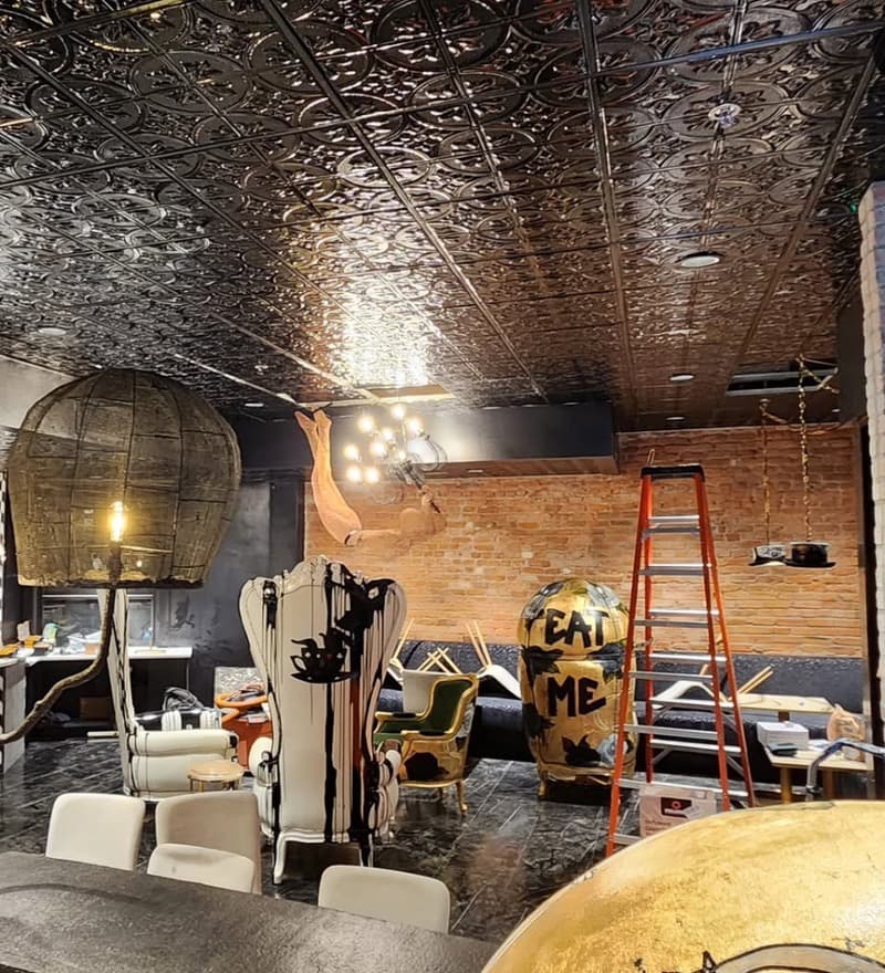 Electrical trim on a designer bar build-out with tin ceiling